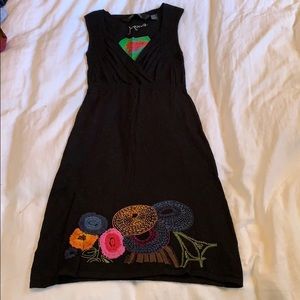 Knit dress with embroidered hem